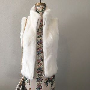 White fur vest